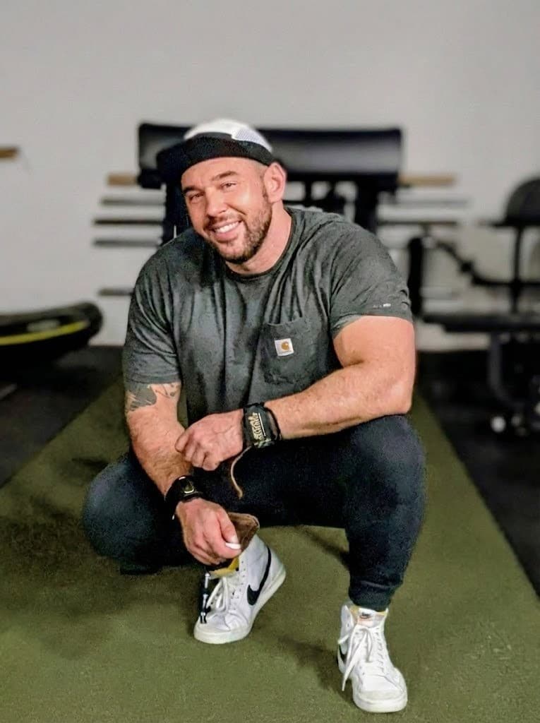 John Richmond crouching in the gym at Carpio Strength & Conditioning