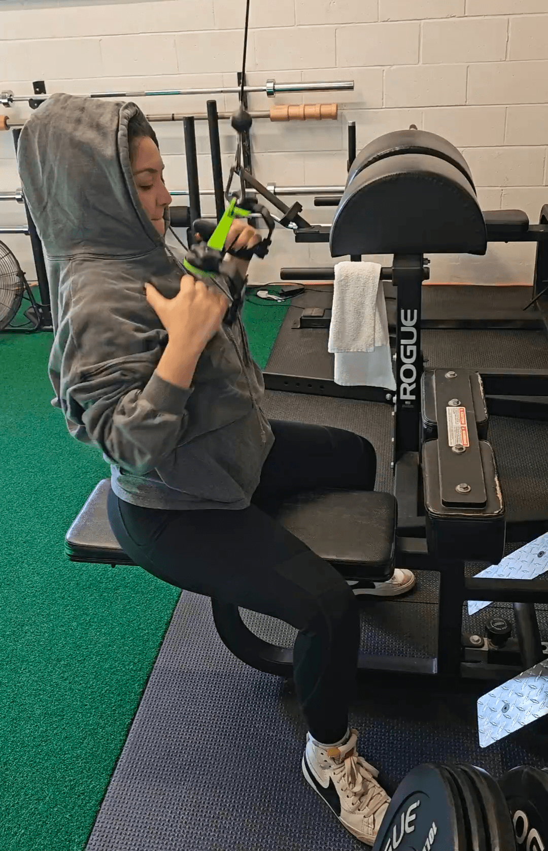 Client performing a seated cable row at Carpio gym