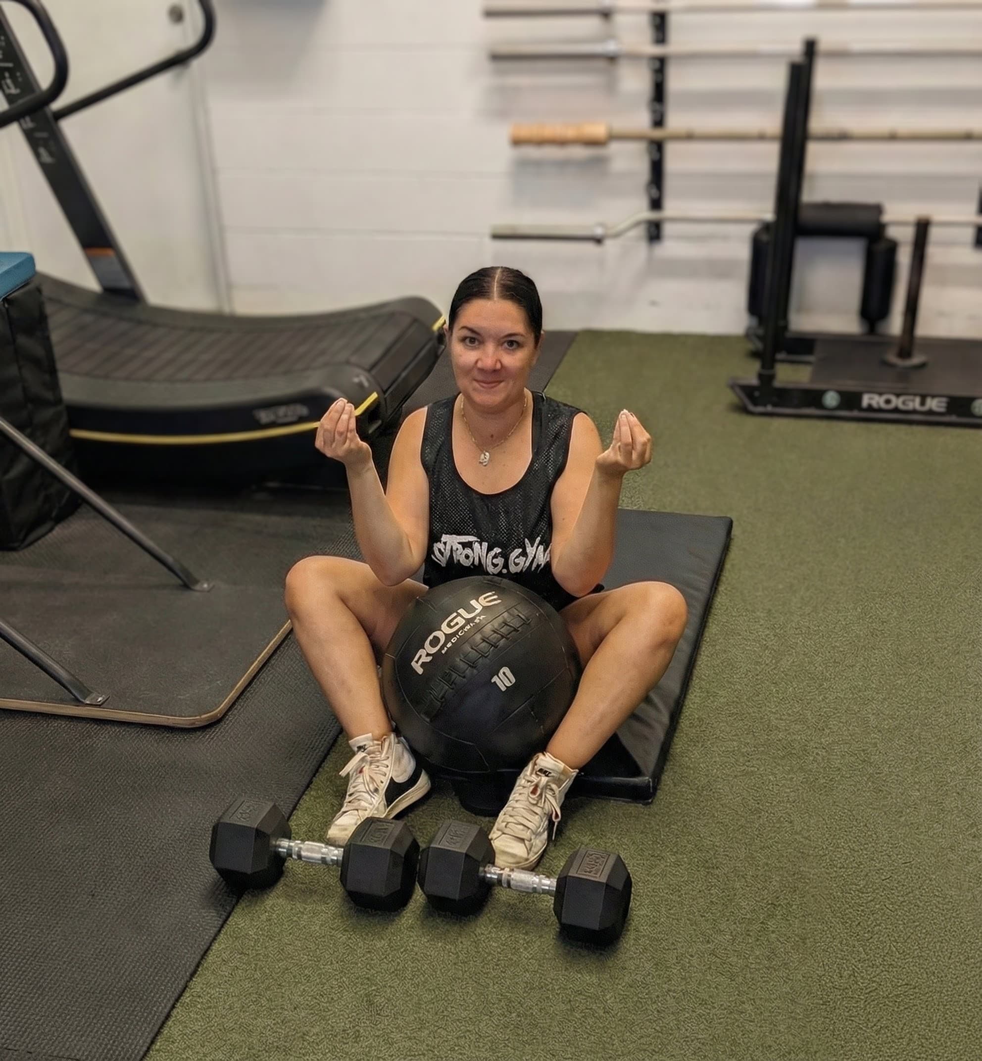 Client training with a medicine ball during a session at Carpio Strength & Conditioning